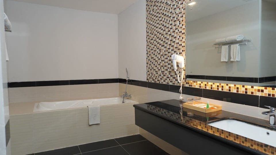 Shower, free toiletries, hair dryer, slippers