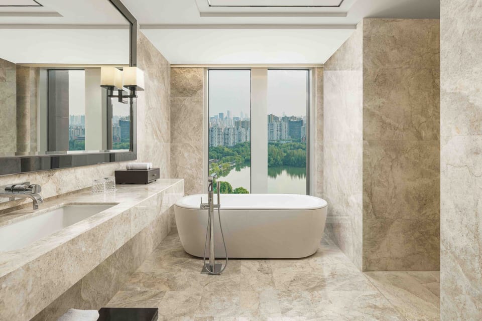 Club Suite, 1 King Bed, Park View | Bathroom | Separate tub and shower, free toiletries, hair dryer, bathrobes