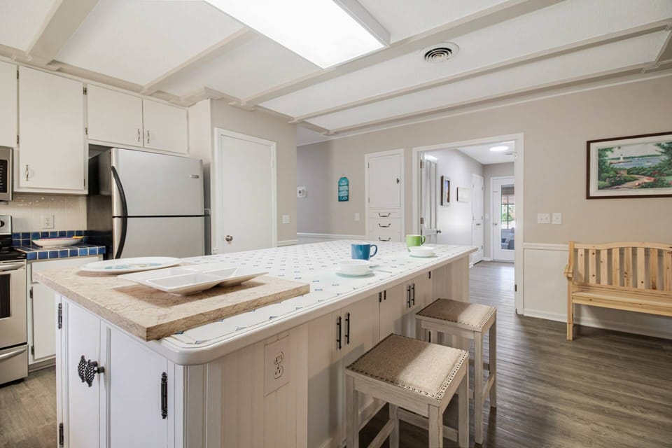 Large open kitchen with bar stools, great place for conversation while making your favorite meals