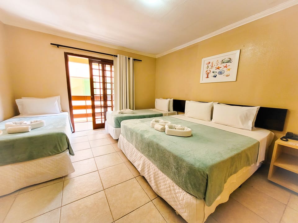 Economy Quadruple Room | Minibar, in-room safe, blackout drapes, free WiFi