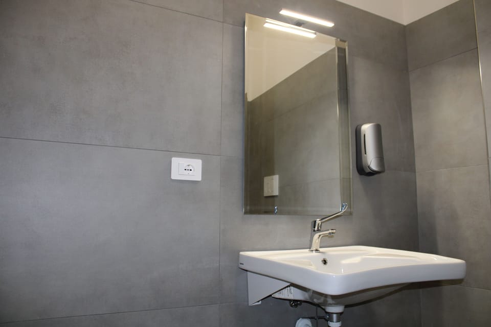 Shared Dormitory, Men only, Private Bathroom | Bathroom | Shower, hair dryer, soap, toilet paper