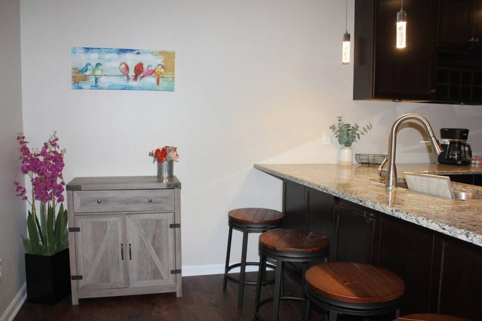 Start your day in style at our rental's charming breakfast bar area. Bask in the warm glow of morning sunlight as you enjoy a leisurely meal or sip on a freshly brewed cup of coffee.