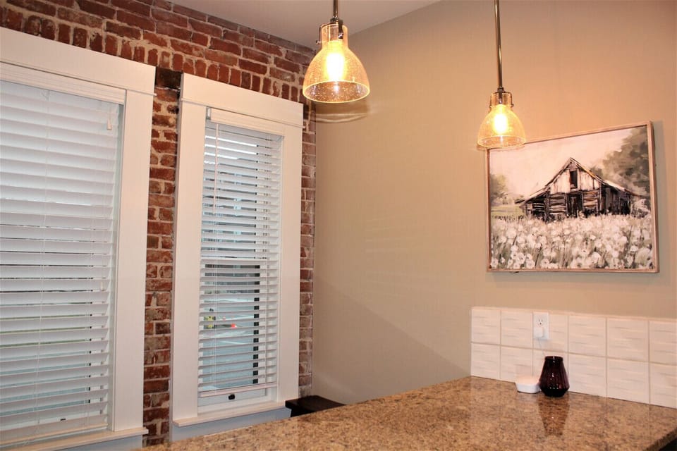 The spacious and well-designed island offers ample countertop space for meal preparation, serving, and casual dining.