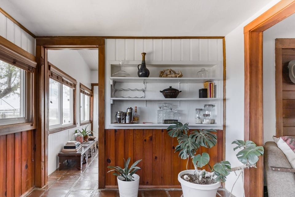 Bright and open kitchen featuring natural light and rustic charm.