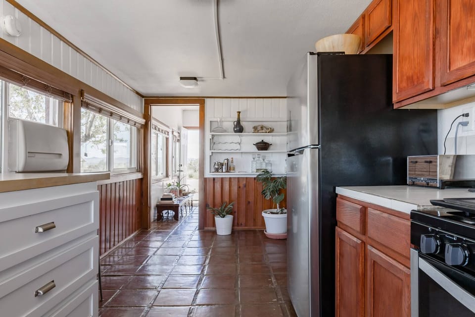 Bright and open kitchen featuring natural light and rustic charm.