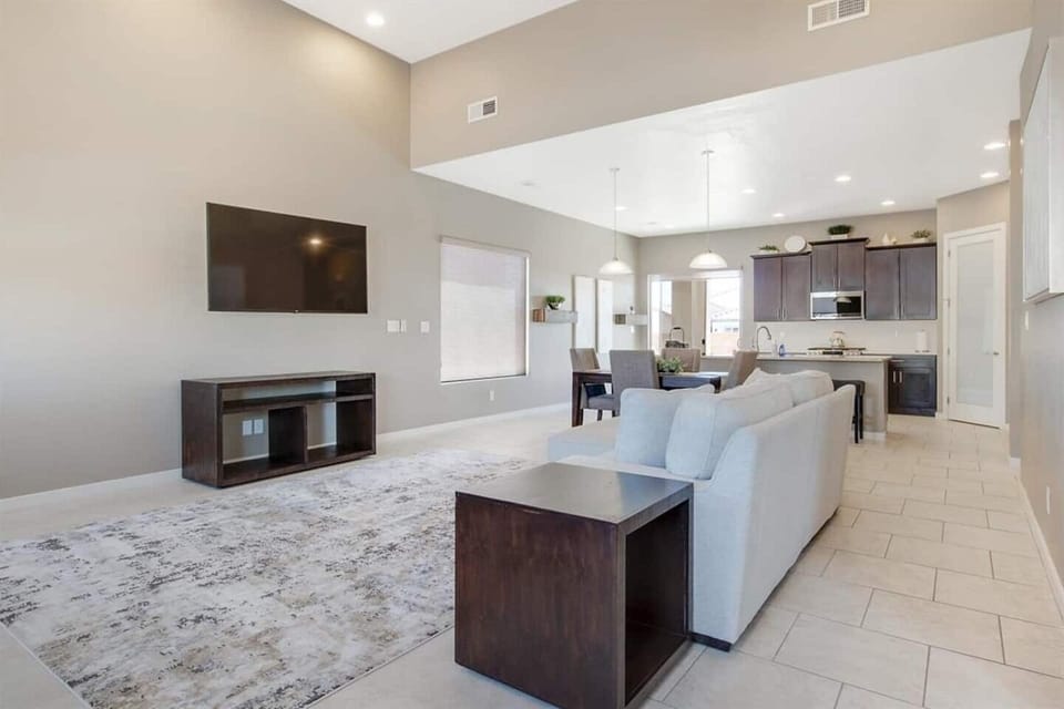 Smart television and living room with lots of space to visit with friends and family