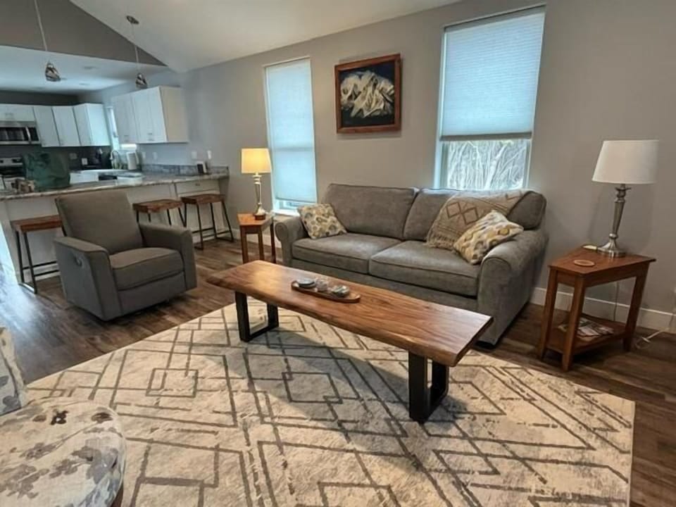 Bright and clean living room opens to the kitchen