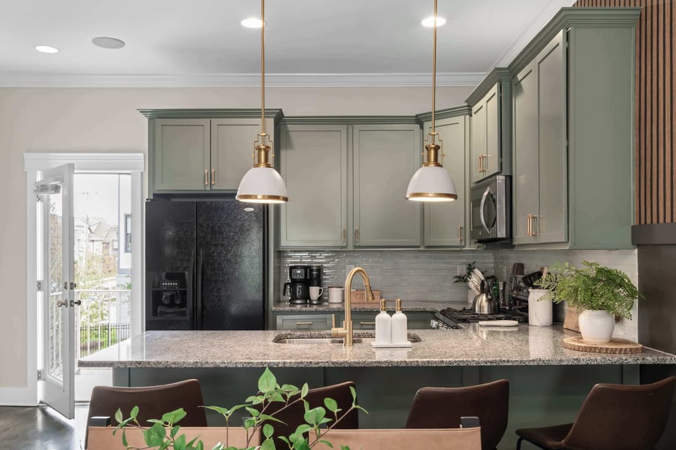 Enjoy casual dining at the well-lit kitchen counter with additional seating