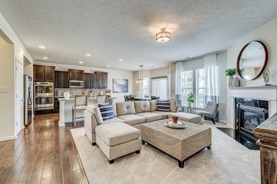 Spacious living room with gas fireplace.