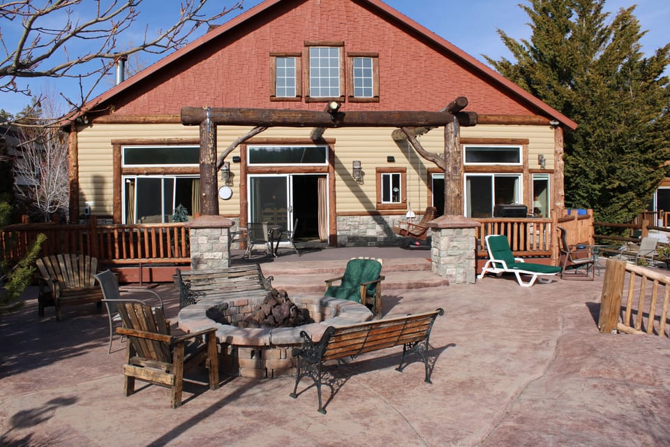 Private Lakefront patio has an outdoor firepit, spa, BBQ, and plenty of seating!