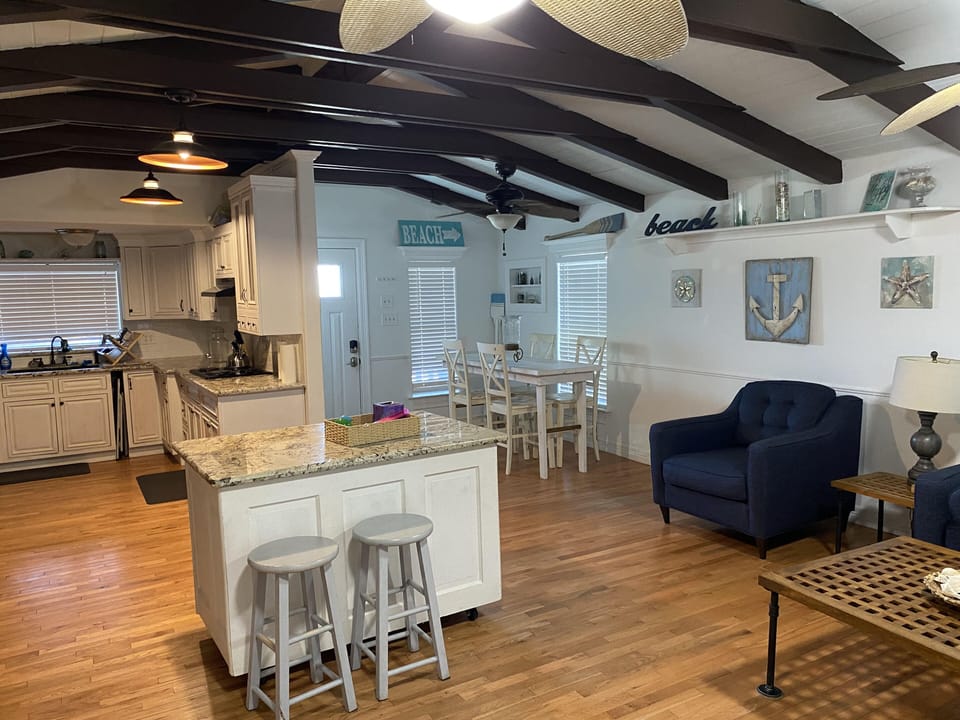 Living Area 1 with Kitchen, Floating Island and Eating Table. 