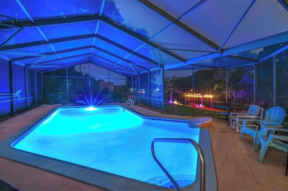 Evening swim vibes with pool lights.