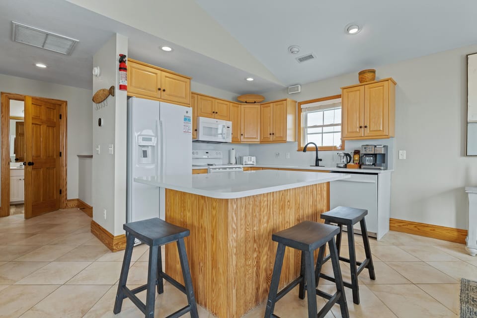 kitchen and island to sit around enjoying company.  New stainless appliances now