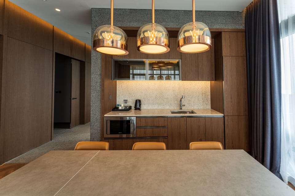 Signature Room | Living area | 55-inch flat-screen TV with cable channels, TV