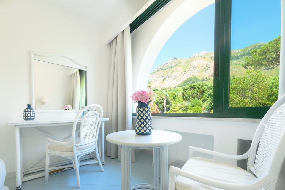 Comfort Room, Non Smoking, Garden View | Down comforters, in-room safe, desk, blackout drapes