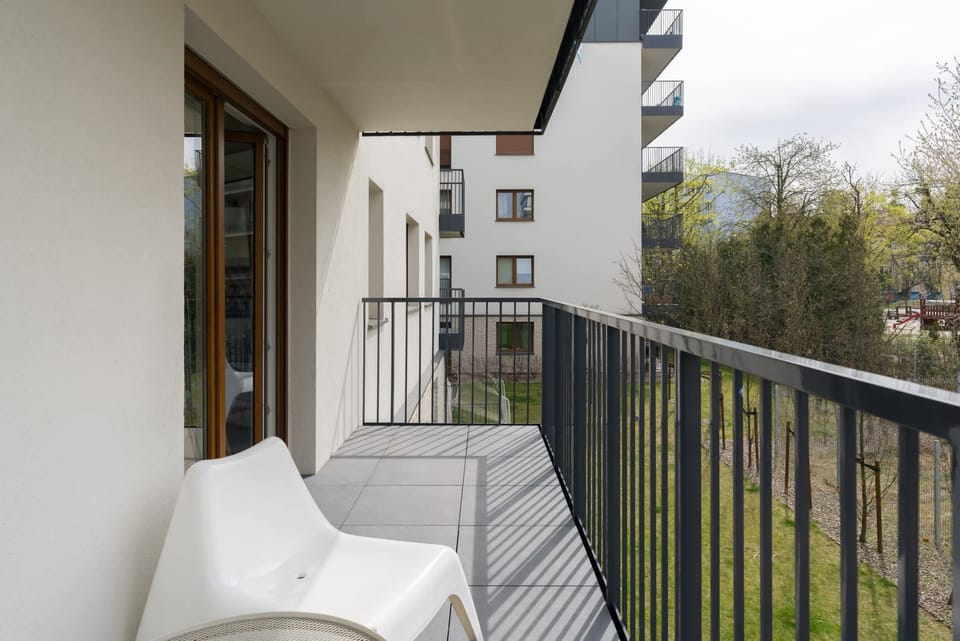The balcony provides a serene environment for relaxation. 
