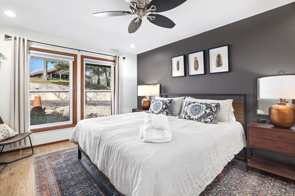 Our Master bedroom features a King-size bed, huge closet, dresser, 55-inch Hisense Android Smart TV, desk area and large en suite bath.