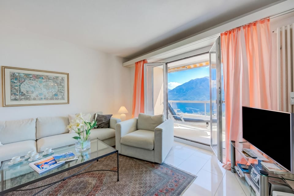 Family Apartment, 2 Bedrooms, 2 Bathrooms, Mountainside (Casa monti belvedere - Locarno Monti) | Living area | Flat-screen TV