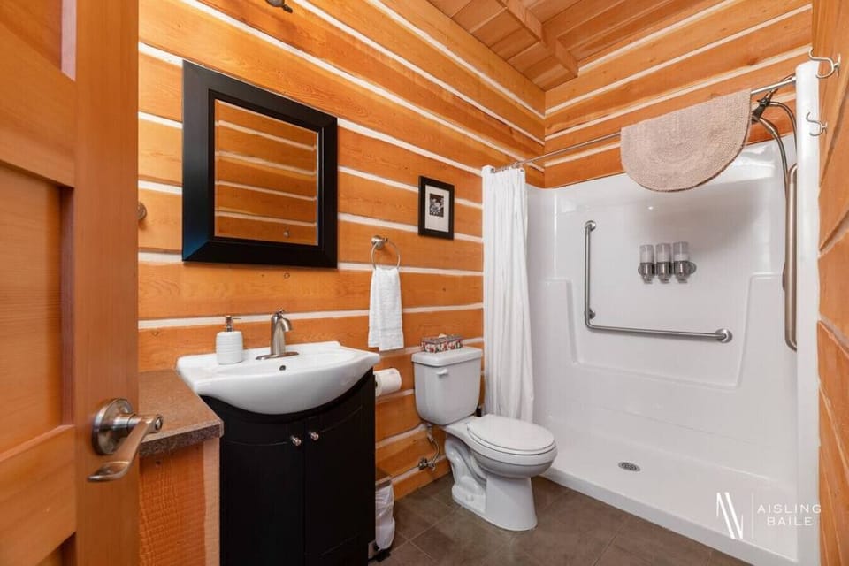 The full bathroom features a stand-alone shower. Each bathroom comes stocked with towels, a hair dryer, shampoo, conditioner & body wash.