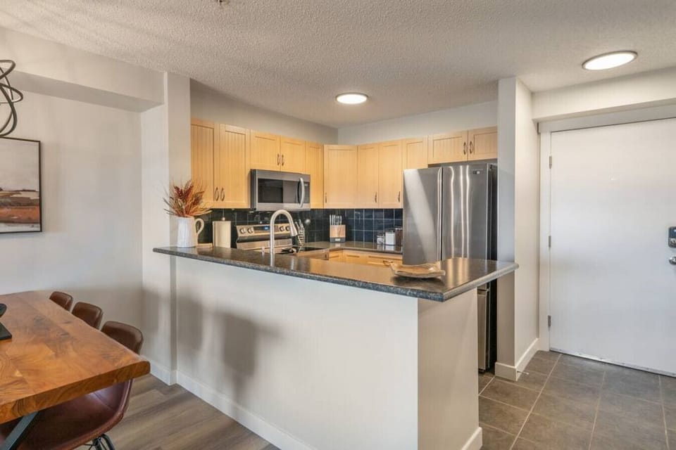 Full kitchen with a drip coffee machine, ground coffee, tea, sugar and basic condiments (ketchup, mustard and relish.)