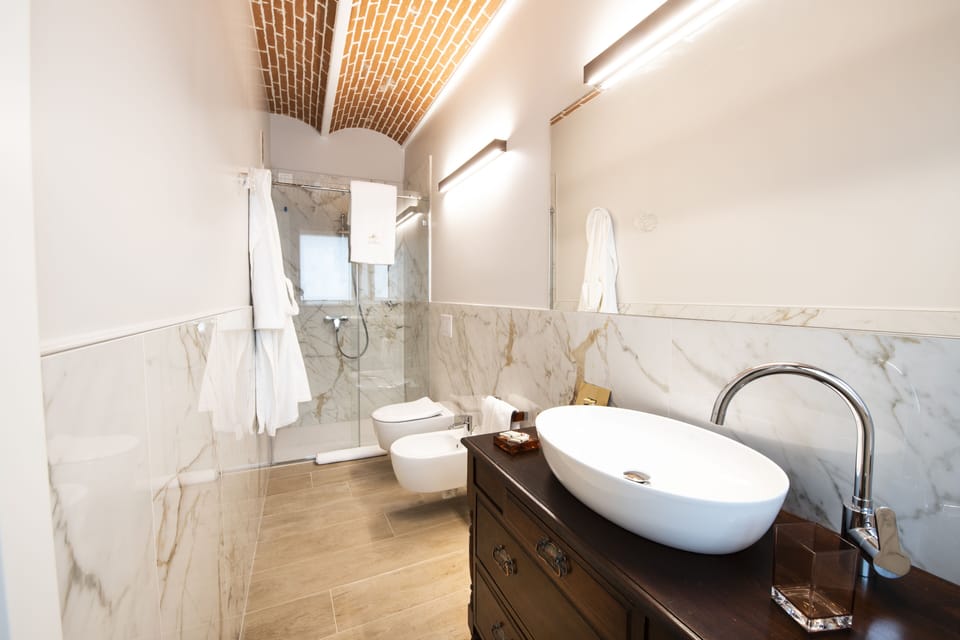 Superior Room | Bathroom | Hair dryer, bathrobes, slippers, bidet