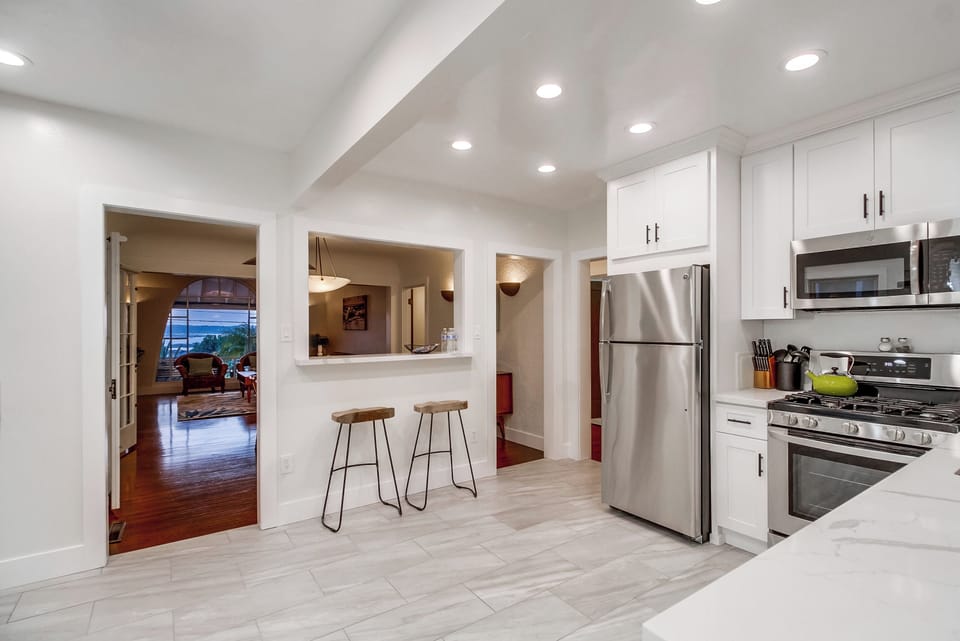 Discover culinary delights in the fully stocked kitchen of Seaview Oasis, equipped with modern conveniences for an unforgettable cooking experience.