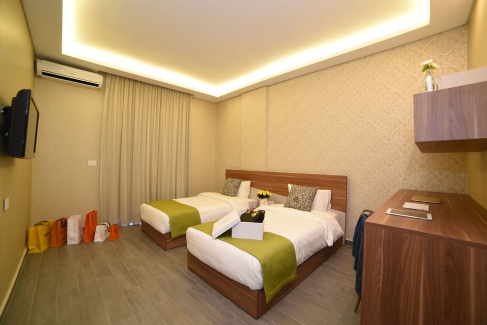 Family Room, 2 Bedrooms | Minibar, in-room safe, desk, laptop workspace