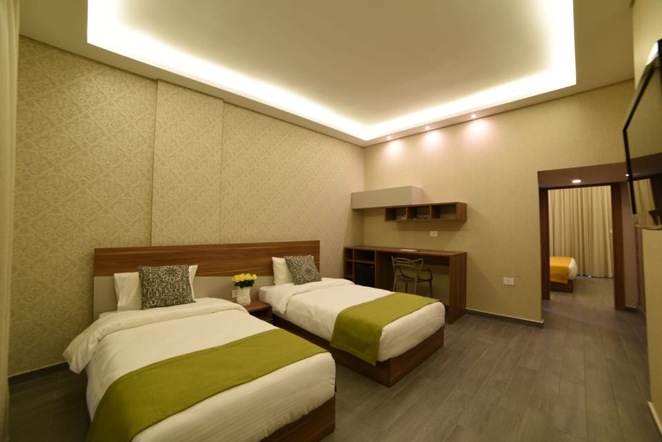 Family Room, 2 Bedrooms | Minibar, in-room safe, desk, laptop workspace