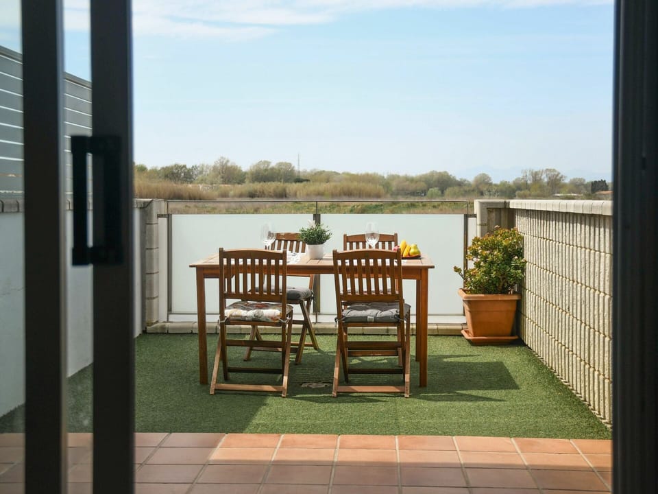 Sky, Furniture, Property, Building, Cloud, Table, Plant, Chair, Water, Wood