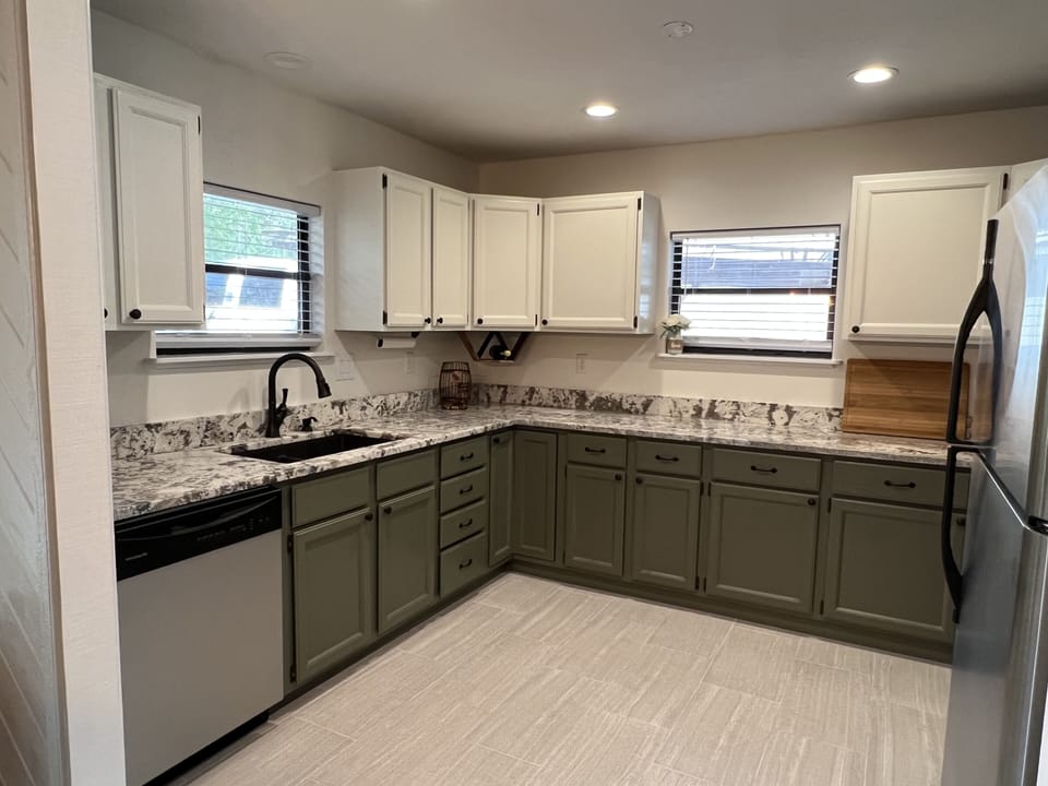 Newly renovated kitchen with granite countertops. 