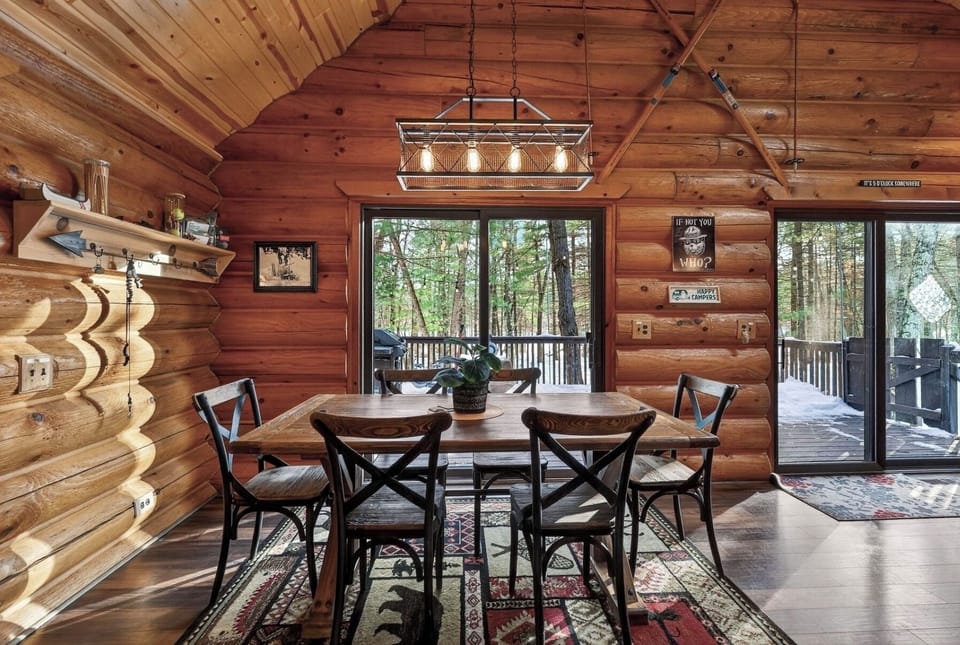 family dining and game area, with indoor-outdoor living to large deck