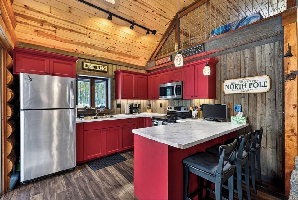 Breakfast bar, flooded with skylight and multiple patio doors to deck