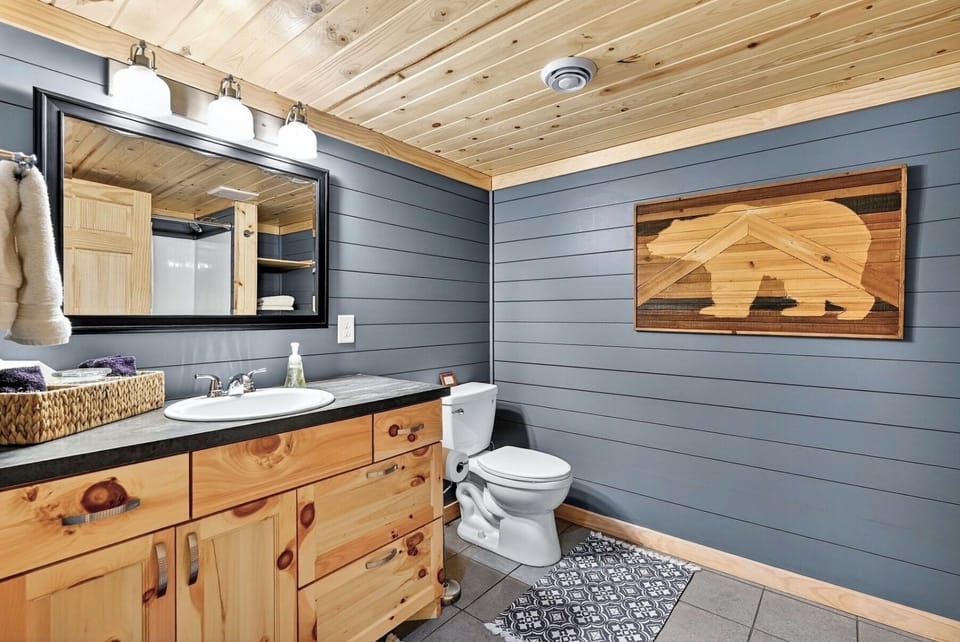 large bathroom with shower-tub combo, generous storage and privacy to walk out 