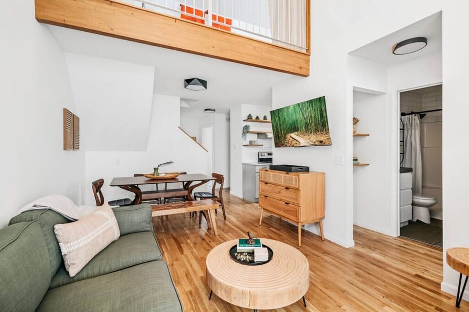 Cozy and spacious living area with modern loft vibes and 3rd bedroom above.