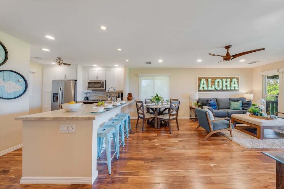 Fully equipped kitchen featuring stainless steel appliances and a breakfast bar for added convenience