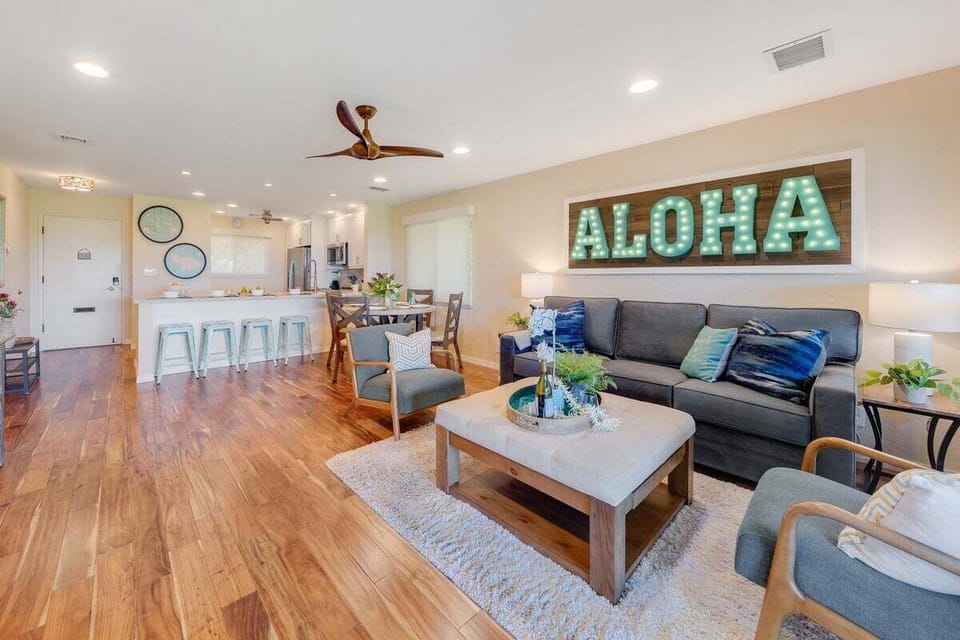 Open-concept living area with a sleeper sofa and fully equipped kitchen, ideal for entertaining and relaxing