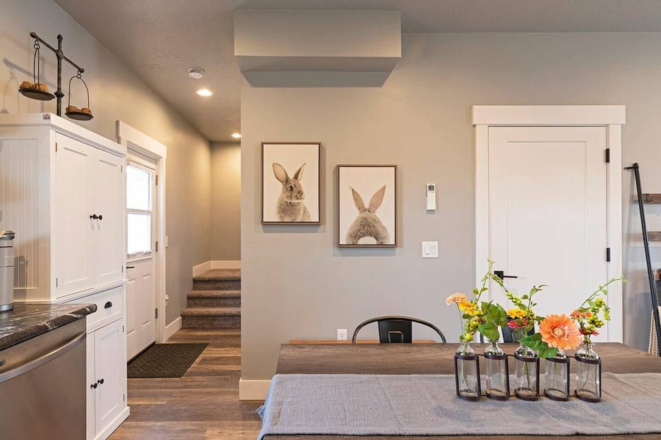 dining area and stairs leading to all 3 bedrooms