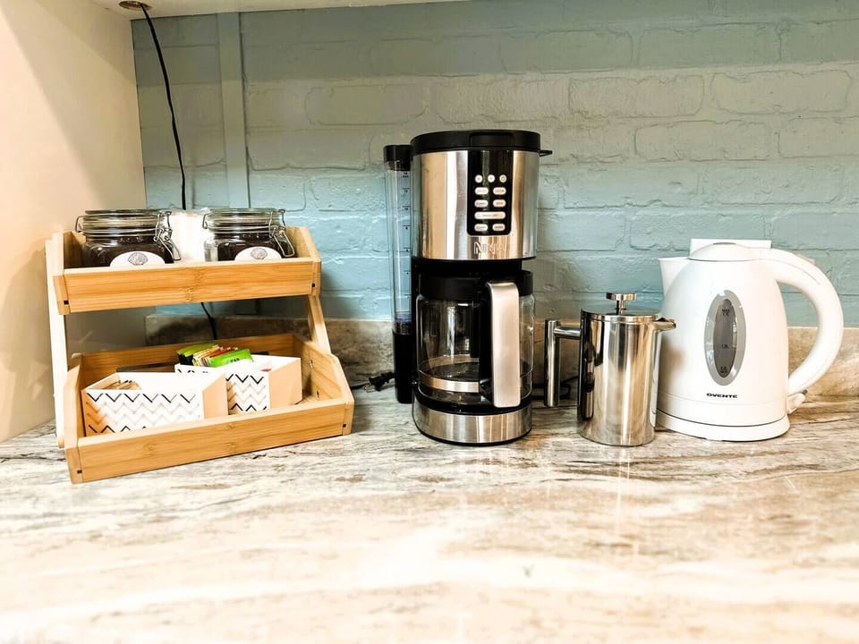 Coffee and tea service complete with French Press and regular drip coffee maker.  Regular and decaf coffee provided