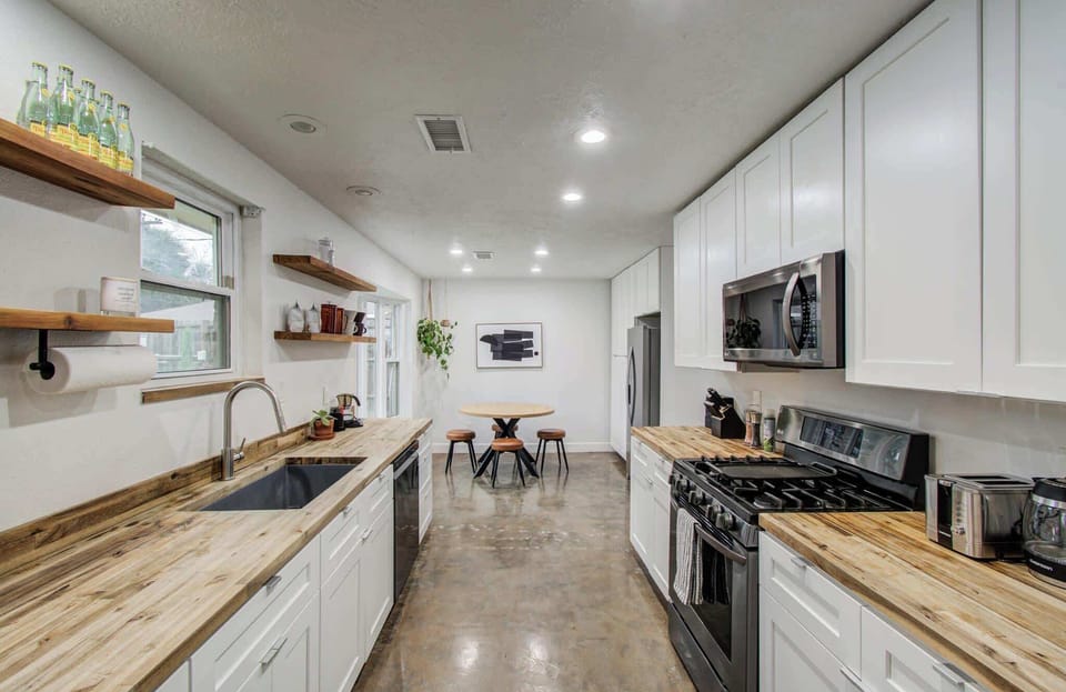 Fully equipped for all your cooking needs, this stylish galley-style kitchen offers the best of modern design and rustic charm.