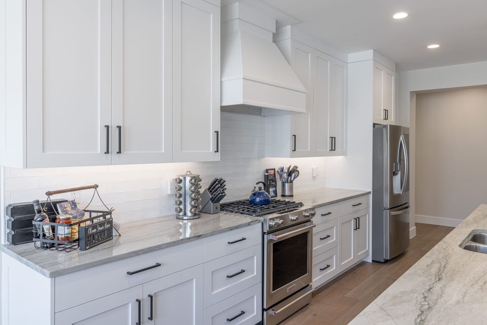Kitchen - The Kitchen is complete with everything you will need for meal preparations including pots, pans, baking dishes, plates, cups, silverware, cutlery, and an assortment of cooking utensils.