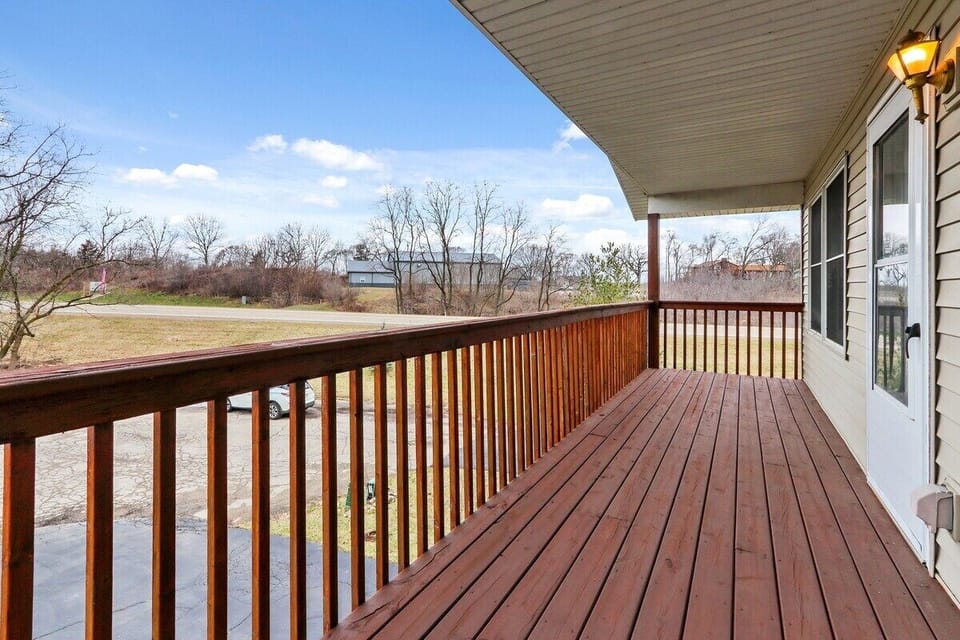 Upstairs-covered deck area off of kitchen