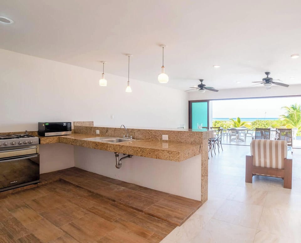A bright, open kitchen perfect for preparing meals while enjoying the natural light and views.
