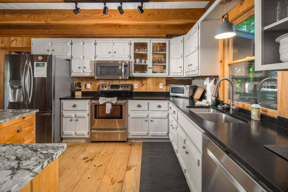 Well-appointed kitchen with modern appliances, ample counter space, and everything needed for memorable meals
