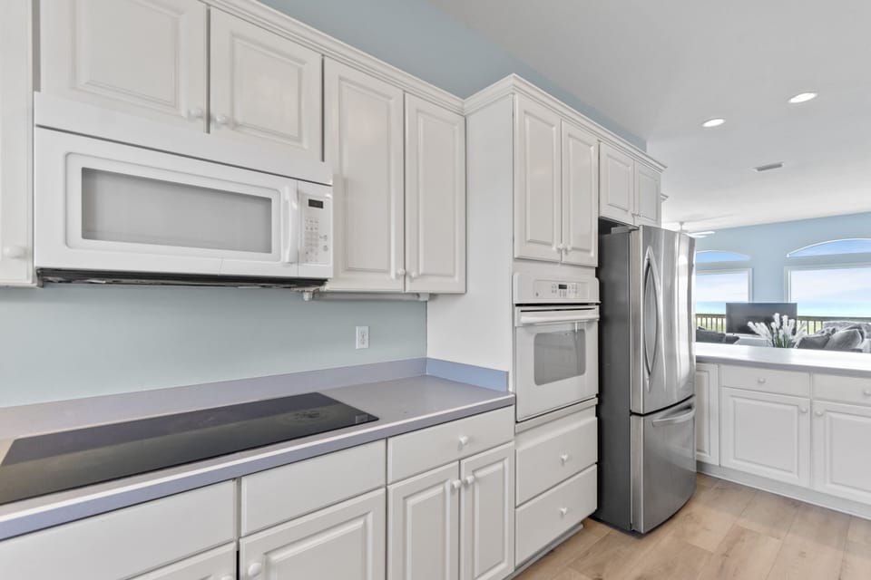 Plenty of cabinetry and a large pantry to store your "stuff"