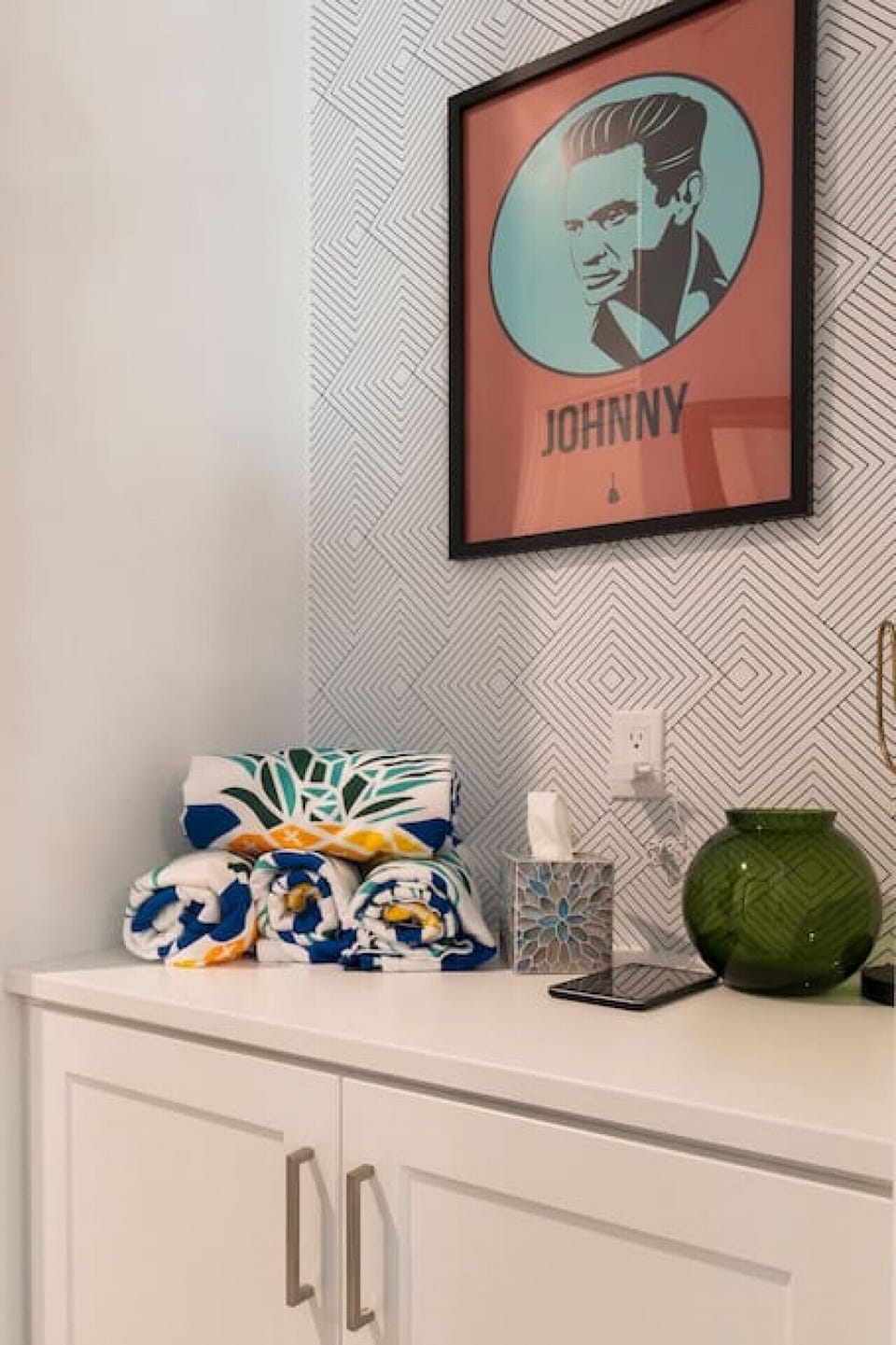 Chic accent wall nook w/ patterned wallpaper, framed art & stylish decor