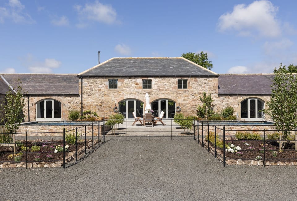 The Steading at West Lyham - large south-facing courtyard with two large water features