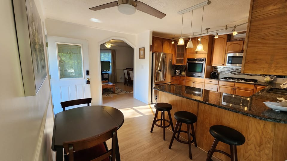 Eat-in bar and table in kitchen.