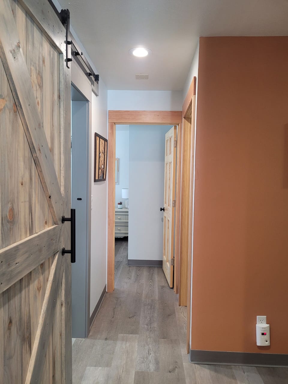 Hallway leading to both bedrooms and bathroom. 