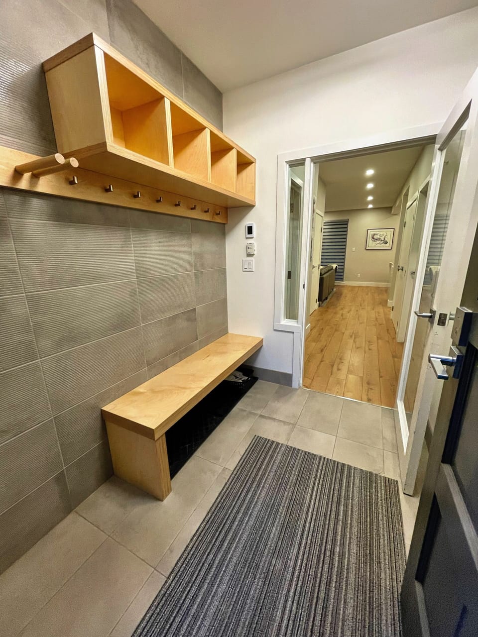 Entry space with bench seating and room for ski/bikes