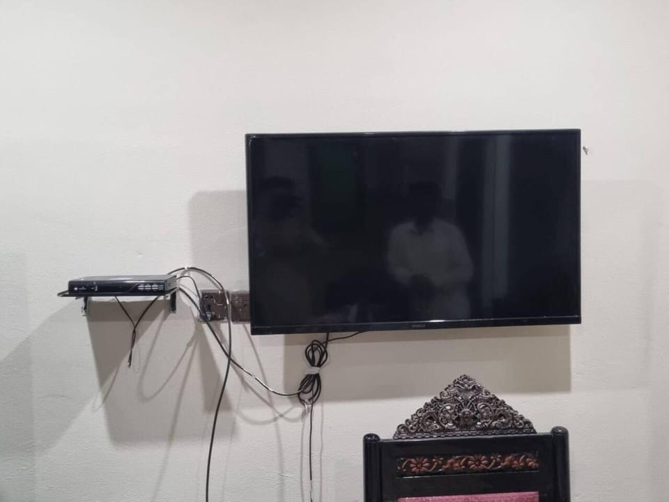 Apartment | Living area | 30-inch TV with digital channels